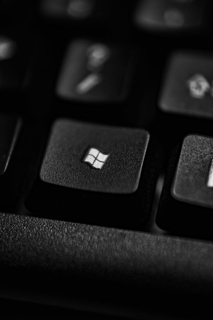 gallery-1 High-quality close-up of a Windows logo key on a black plastic keyboard.
